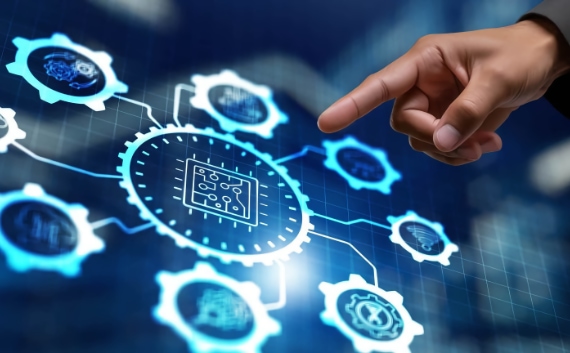 Hand pointing at a set of interconnected cogs