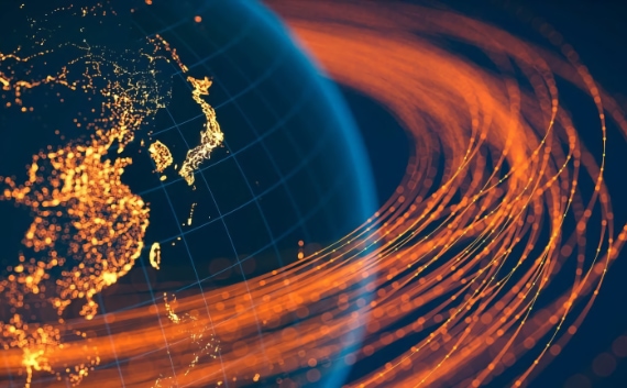 Hand pointing at a set of interconnected cogs